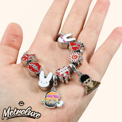 Collection of colorful charms on a hand with 'Metrolux' branding.